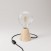 Table lamp with alder base and transparent light bulb